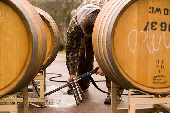 Cleaning a barrel with winery equipment