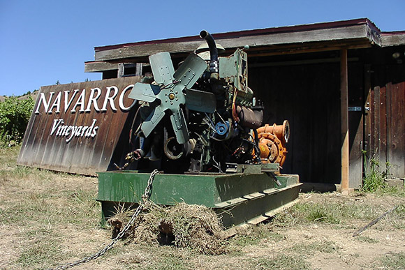 An older diesel irrigation pump being removed.