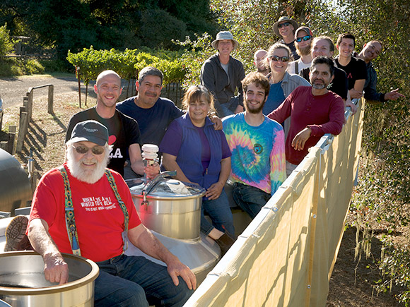 Navarro's 2019 winery crush crew, on top of winery tanks.