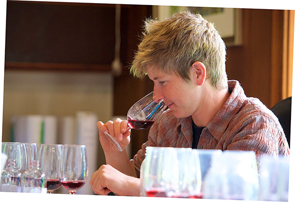 Sarah Bennett, Navarro owner, evaluating a red wine during a morning tasting panel.