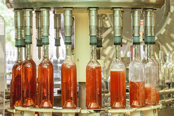 Rosé bing bottled on an antique filler.