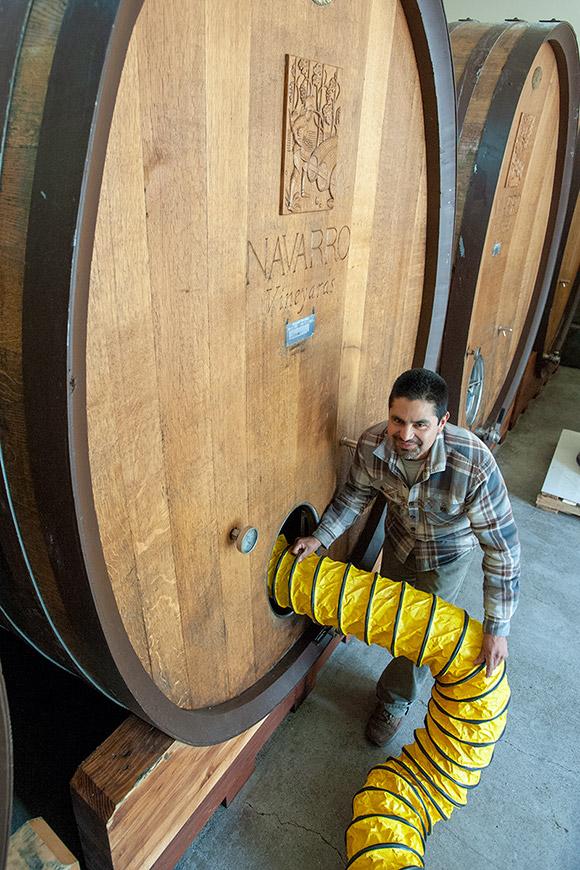 Ulises can be seen here sucking out any remaining gas before entering the cask to clean it.