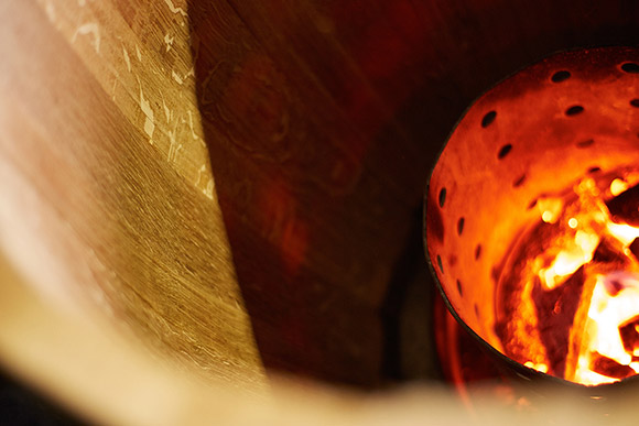 Inside of an oak barrel during construction.