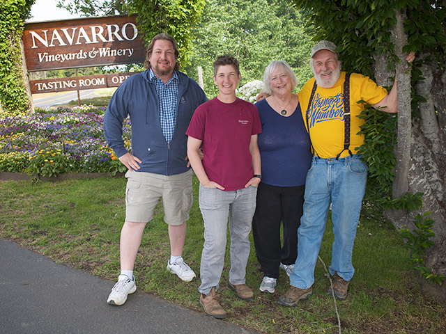 Cahn-Bennett Family in front of the Navarro Vineyards sign